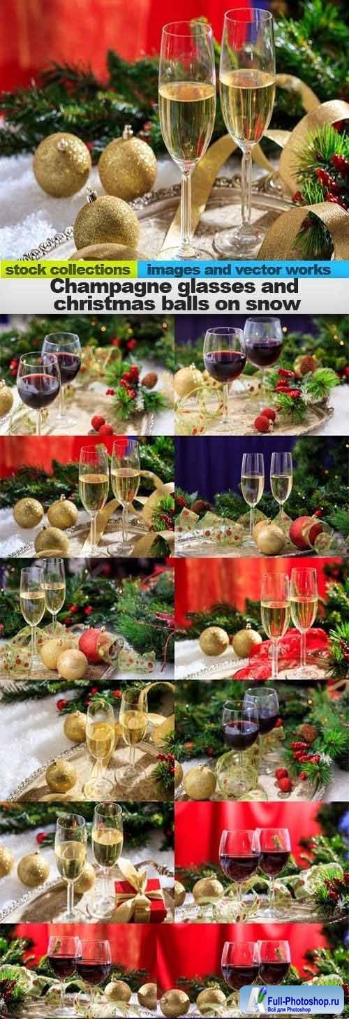 Champagne glasses and christmas balls on snow