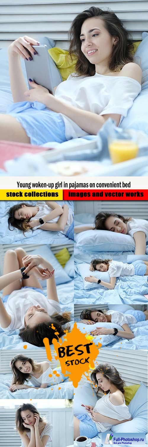 Young woken-up girl in pajamas on convenient bed