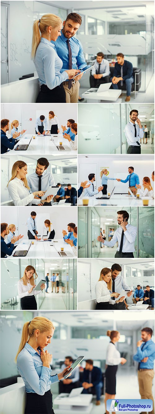 Businesswoman and businessman working with digital tablet in front of group business people