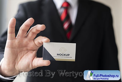 Businessman holding business card mock-up