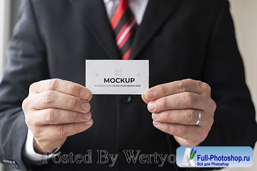 Businessman holding business card mock-up with both hands